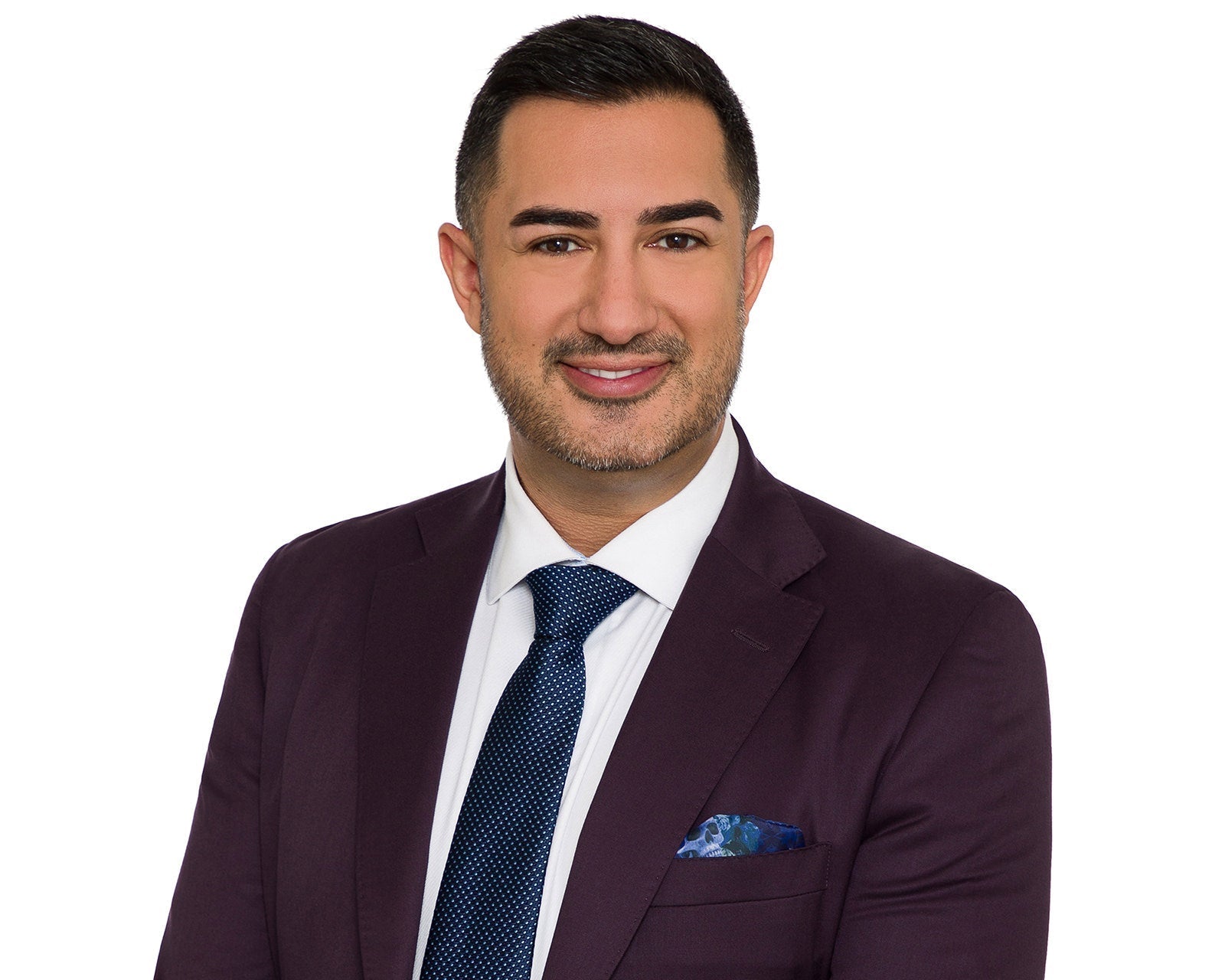 Corporate head-and-shoulders headshot on a clean neutral background, framed to the standard corporate crop