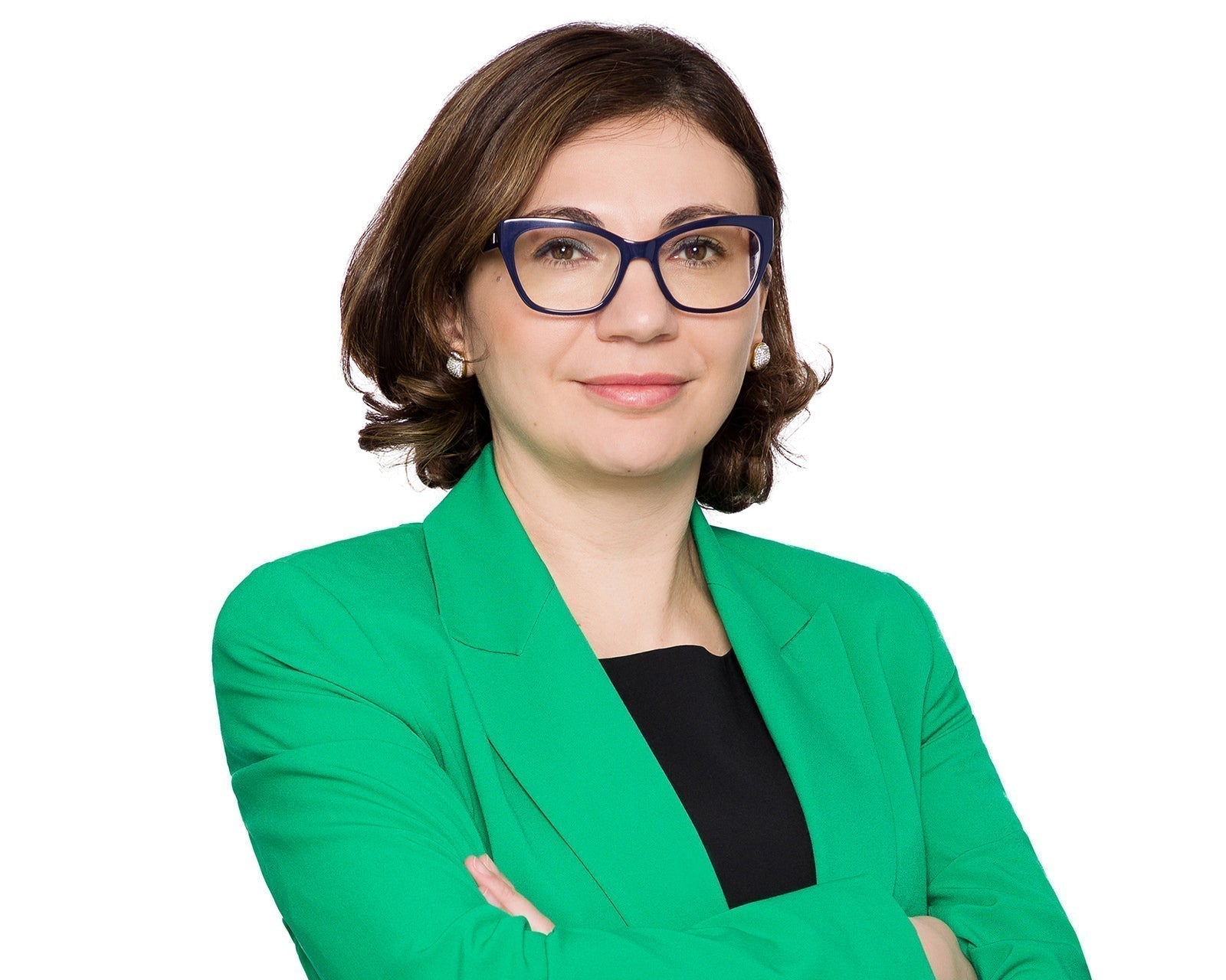 Corporate headshot of a businesswoman in a navy blazer on a white background, delivered as a high-resolution master file