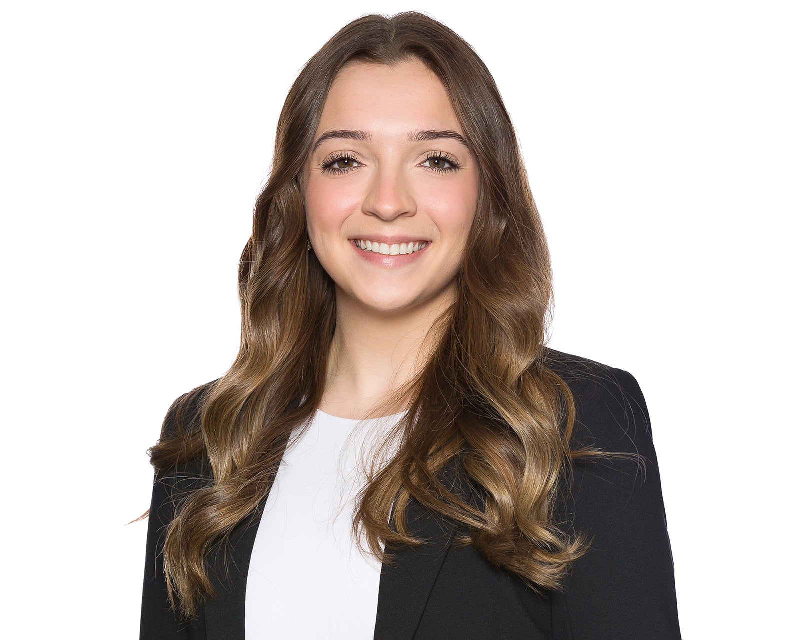 Professional corporate headshot of a woman in a black blazer on a white backdrop from a company headshot day